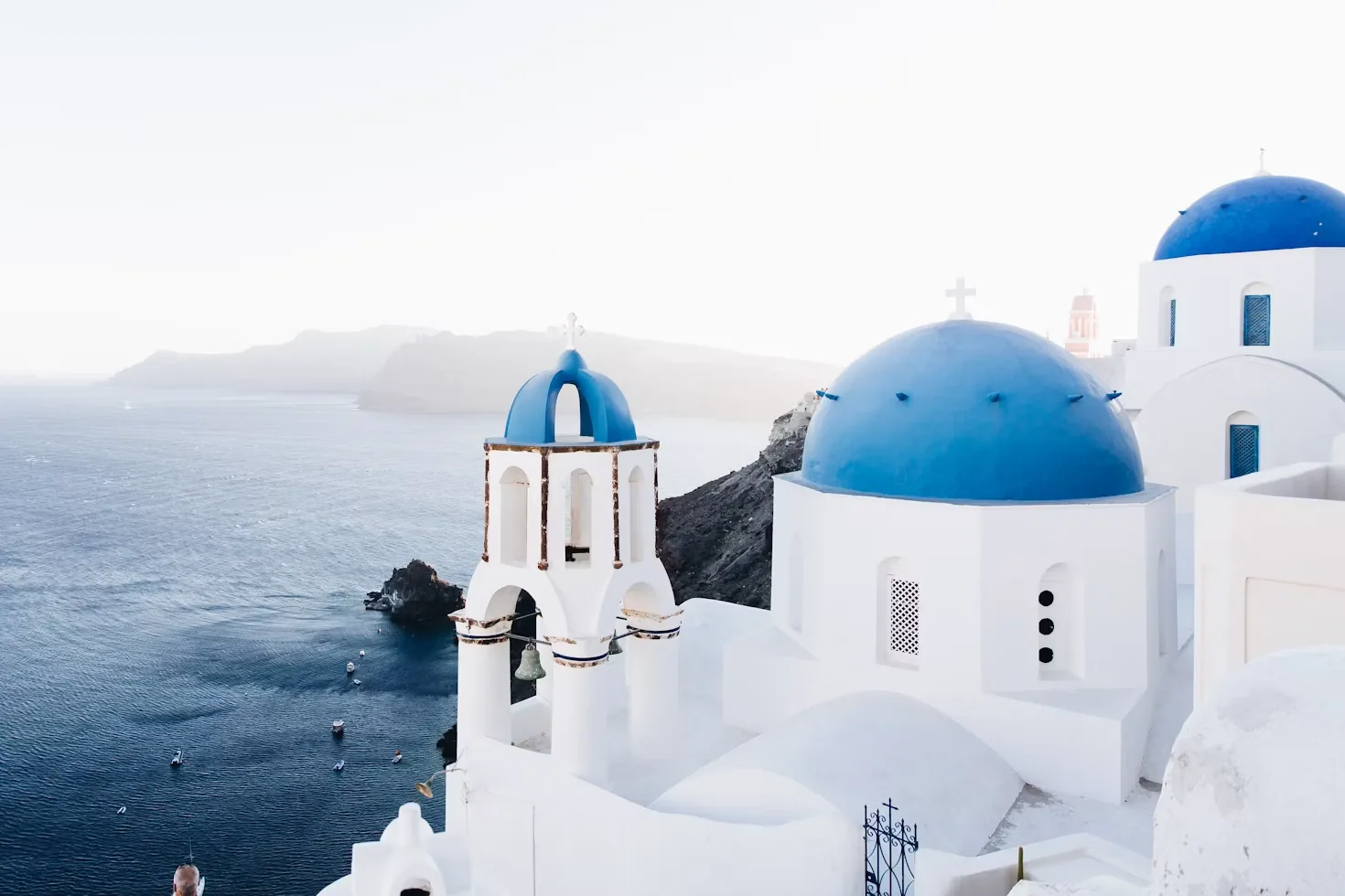 White houses and blue domes above the sea in Santorini